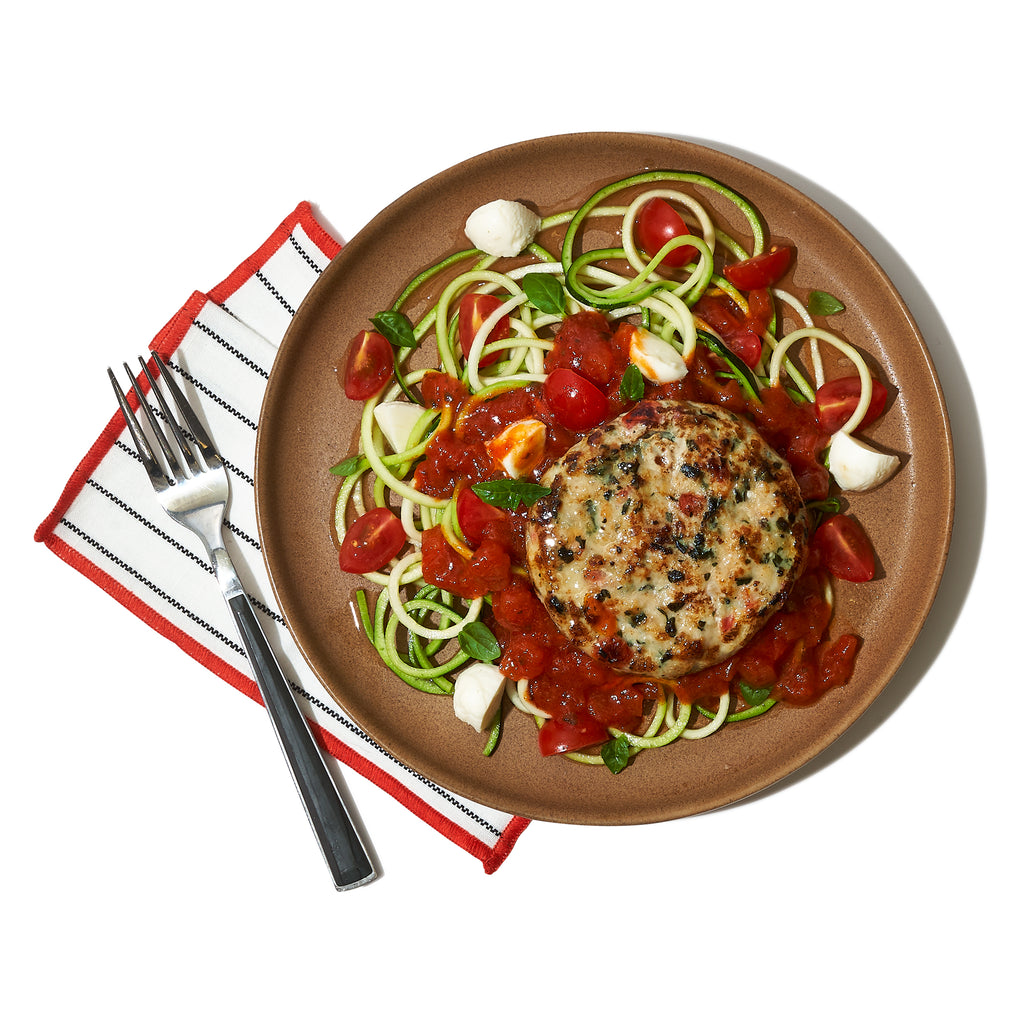 BRUSCHETTA CHICKEN ON A BED OF ZOODLES